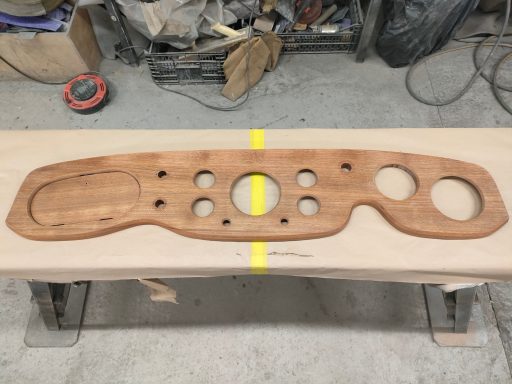 Wooden dashboard panel featuring multiple holes and cutouts for gauges and controls. All prepaired and ready for veneering